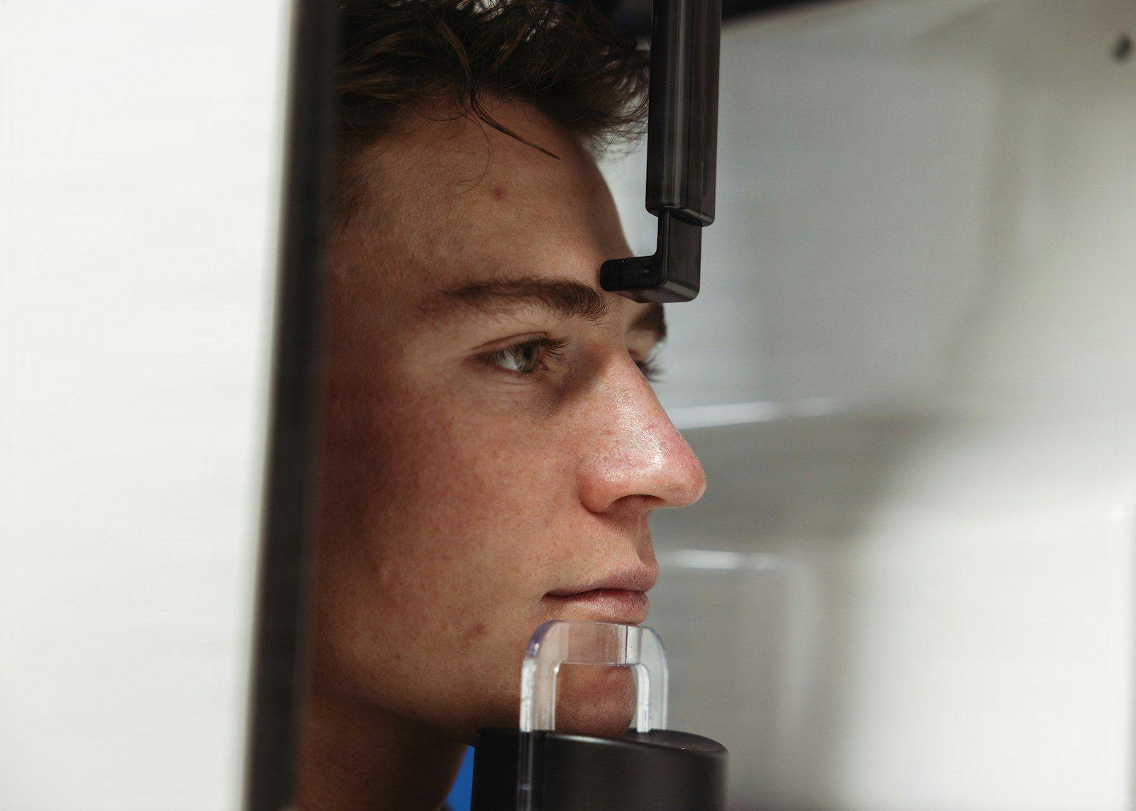 Young man's face in medical imaging equipment